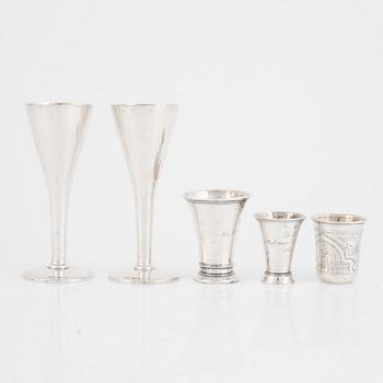A set of five silver beakers, including MGAB, Stockholm 1946.