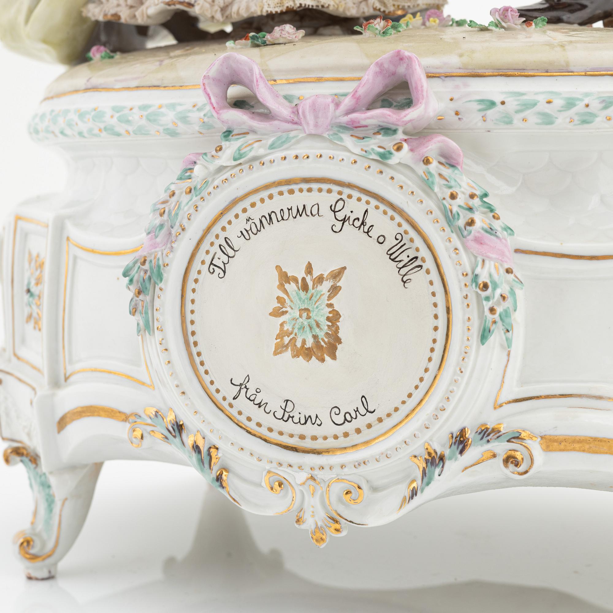 A rococo style porcelain figurine from the early 20th century.