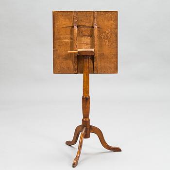 A tilt-top tripod table,  first half of the 19th century.
