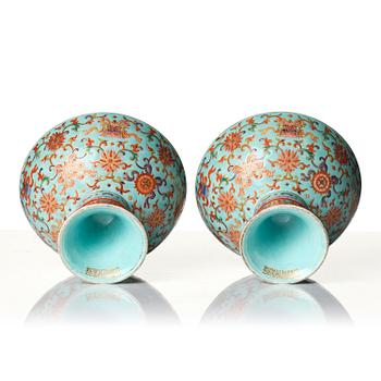 A pair of rare turquoise ground 'baijiaxiang' stemcups, Qing dynasty with Daoguang mark and period (1821-1850).