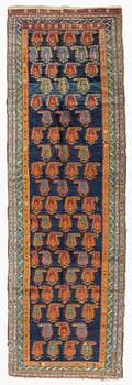 An Oriental runner carpet, circa 347 x 108 cm.