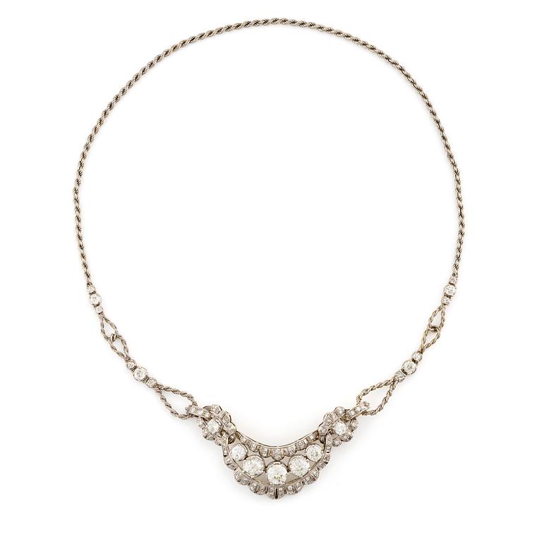 A brooch/necklace combination in 18K white gold set with old- and eight-cut diamonds.