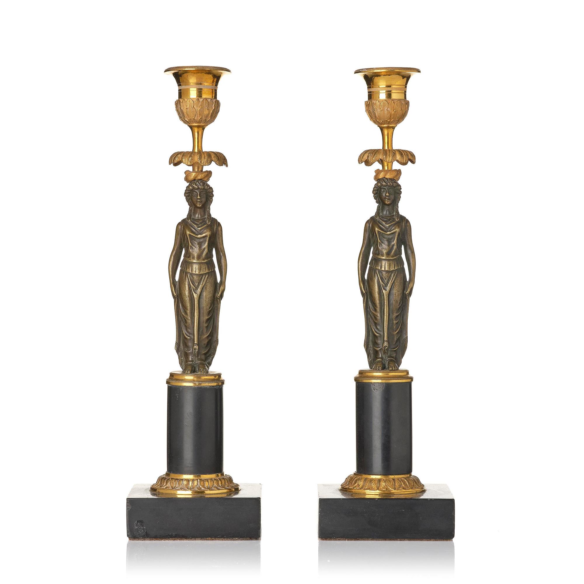 A pair of late Gustavian marble and ormolu candlesticks in the manner of F. L. Rung (1758-1837).