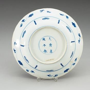 A blue and white klappmutz bowl, Qing dynasty, with Kangxi six character mark and of the period (1662-1722).