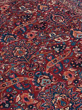 A CARPET, a semi-antique Mashad, ca 400-404 x 314 cm.