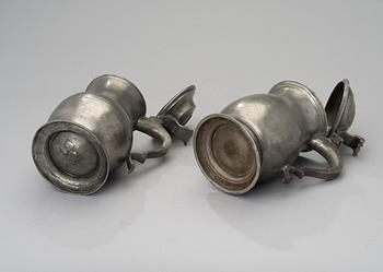 Two early 19th century pewter tankards.