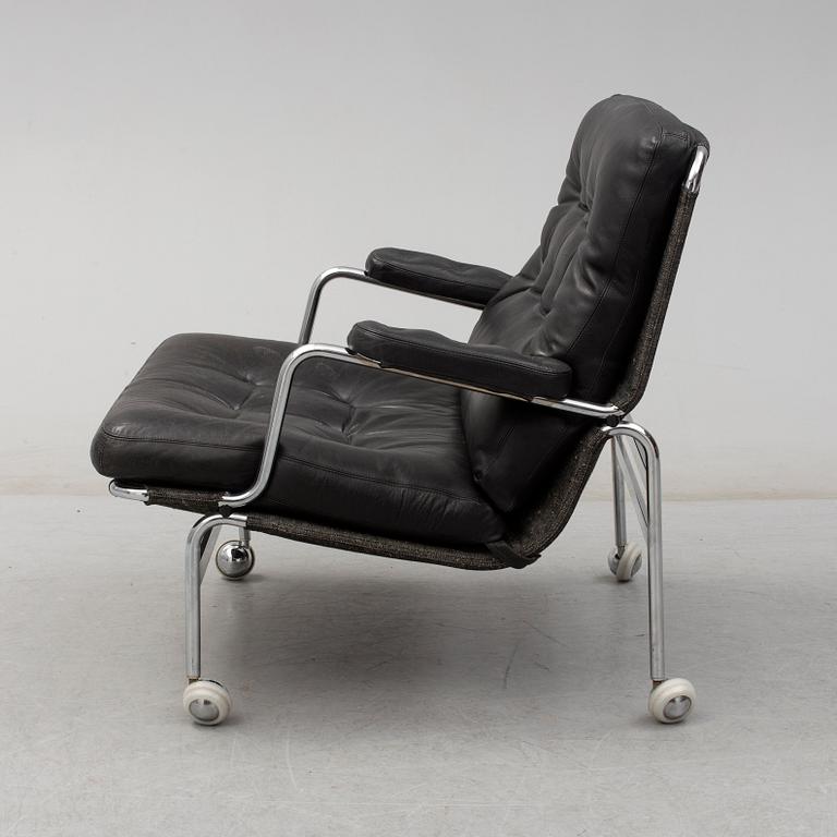 BRUNO MATHSSON, a "Karin" black leather easy chair.