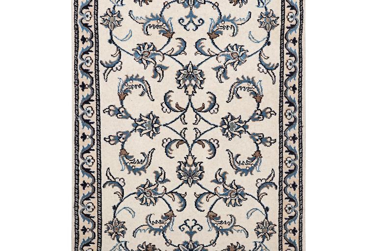 A runner carpet, Nain, part silk, c.297 x 80 cm.