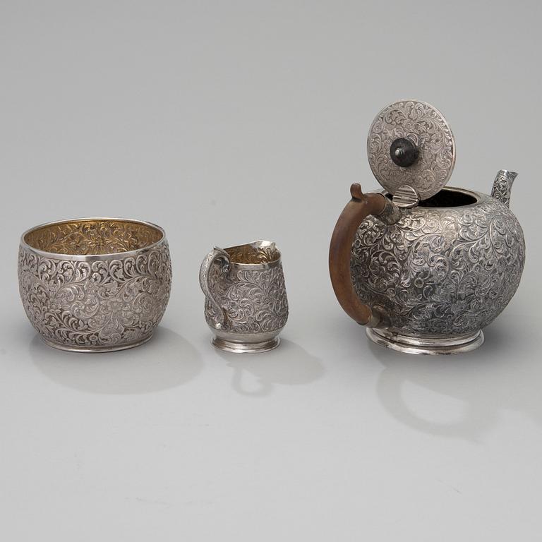 A three-piece Persian silver set for tea.