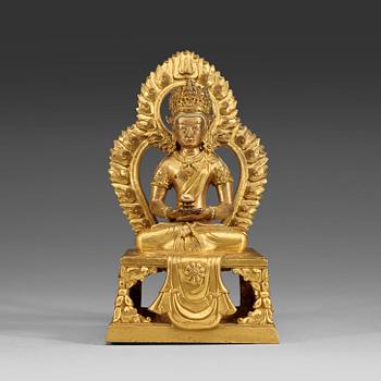 1318. A gilt bronze figure of Amitayus, Qing dynasty, Qianlong (1736-95).