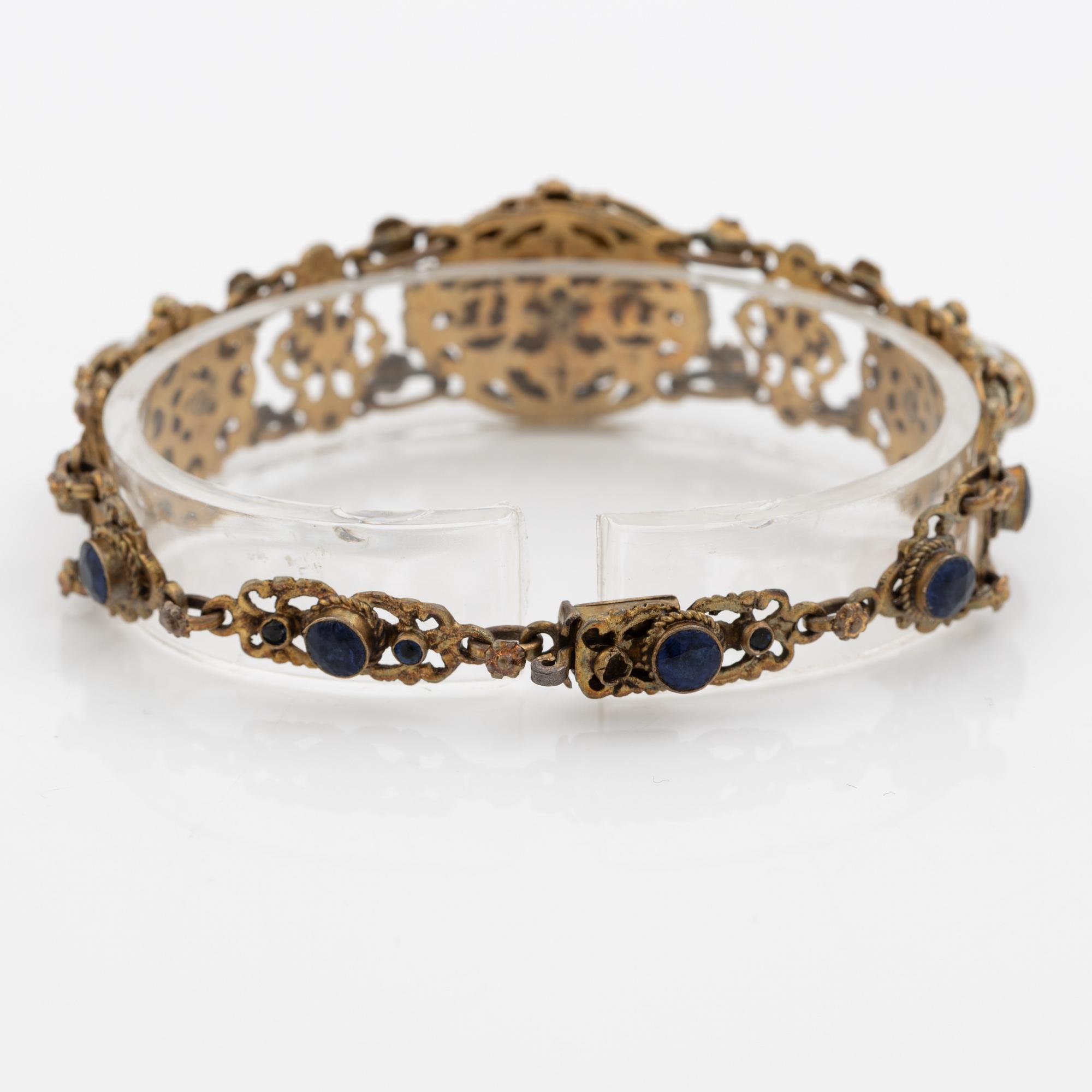 Bracelet, gilded silver with synthetic blue stones.
