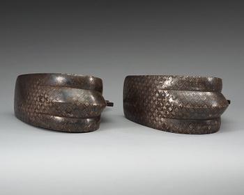 A pair of Japanese silvered bronze stirrups, Meiji (1868-1912).