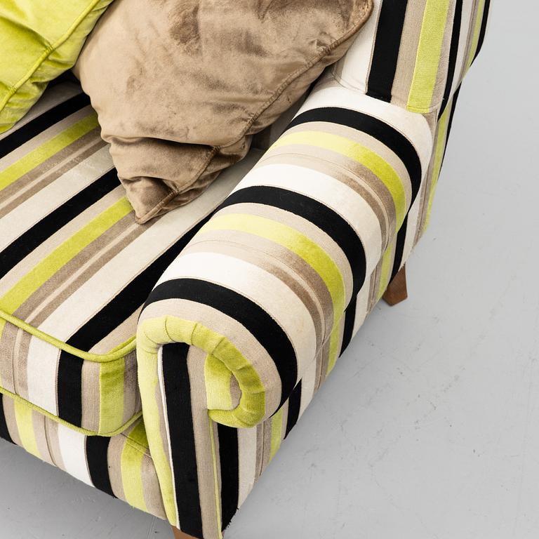 A lounge chair with foot stool, BQ of Sweden.