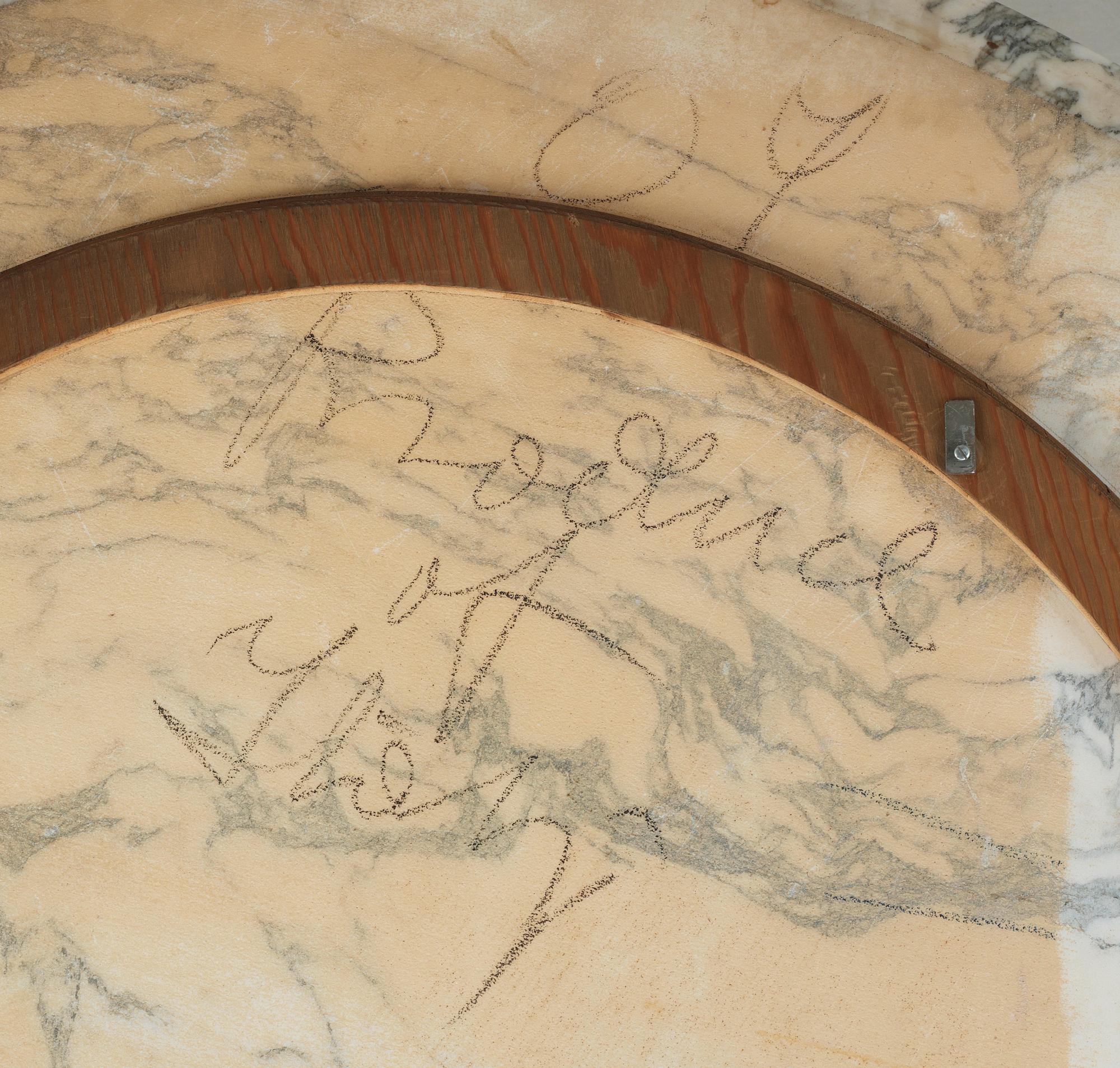 An Eero Saarinen 'Tulip' marble top dining table, Knoll International, USA.