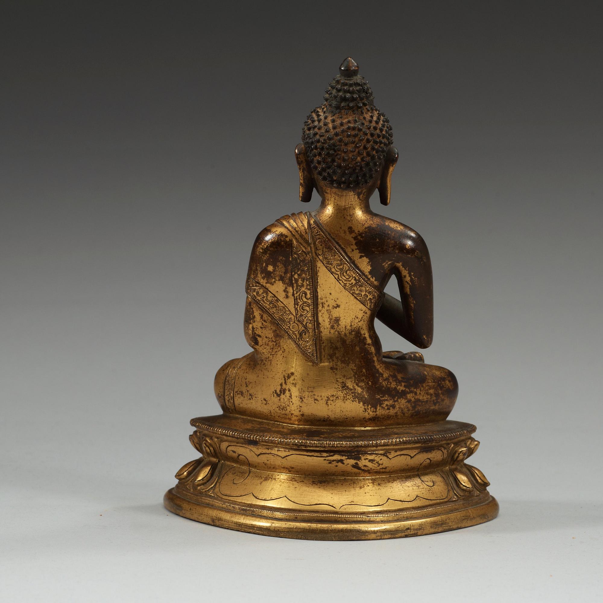 A gilt bronze figure of Buddha, Sinotibetan, 18th Century.