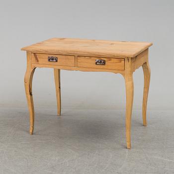 A 20th century rococo style writing desk.