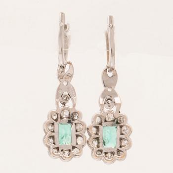 A pair of 18K white gold earrings set with baguette-cut emeralds and various cut diamonds, G. Dahlgren & Co Malmö.
