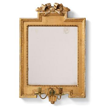 120. A Gustavian giltwood two-light girandole mirror by J. Åkerblad (master in Stockholm 1754-99).
