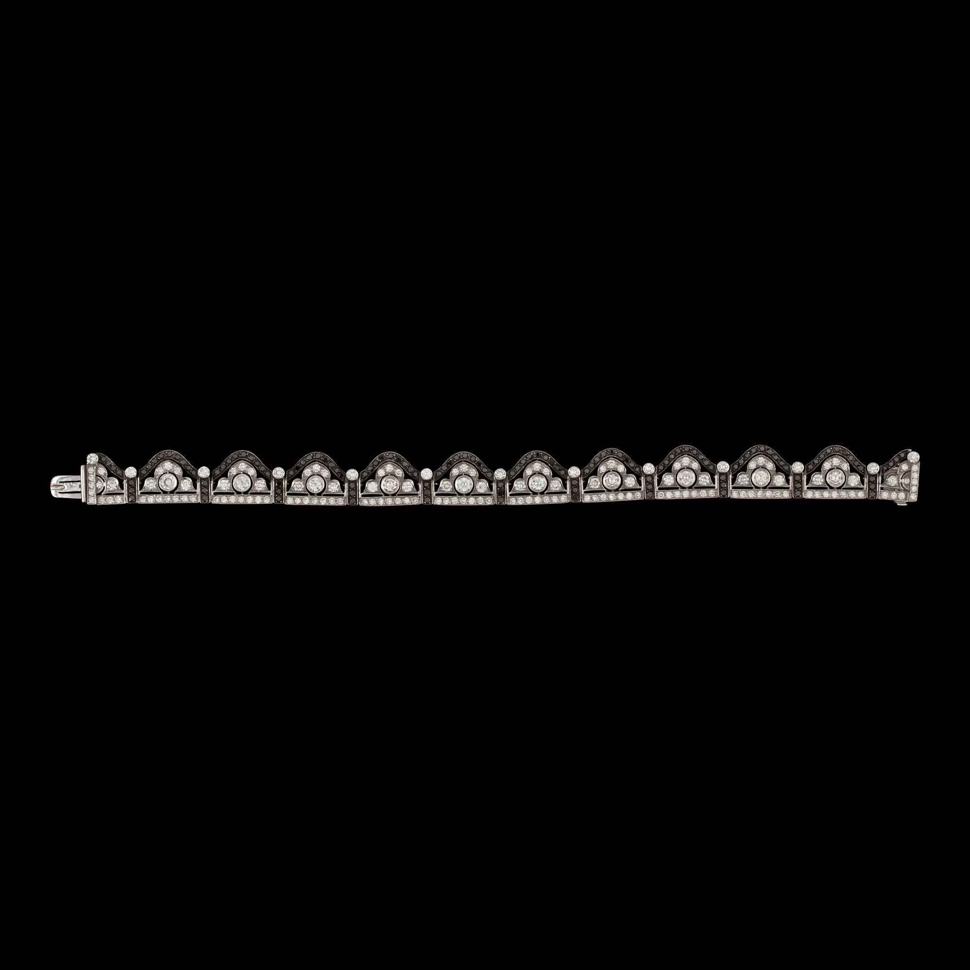 A black and white diamond bracelet. Total carat weight 6.89 cts.