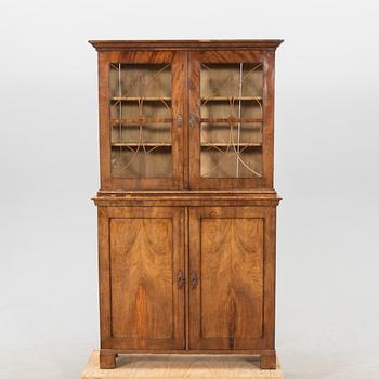 A mid 1800s mahogany book cabinet.