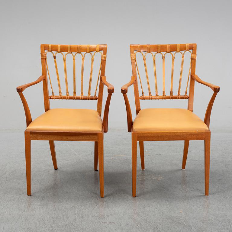 A pair of Josef Frank mahogany and rattan armchairs, Svenskt Tenn, Stockholm, Sweden.