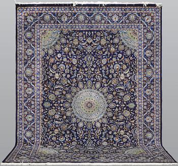 A Kashmar carpet, approx. 390 x 290 cm.