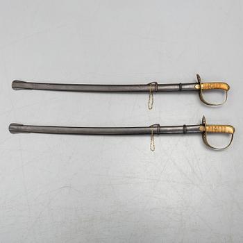 Two cavalry sabres 1867 pattern with scabbards.