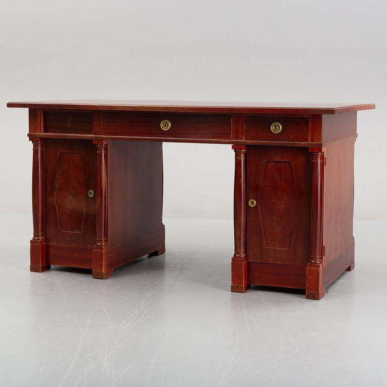 An Empire style writing desk, first half of/mid 20th century, and an Empire style chair, early 20th century.