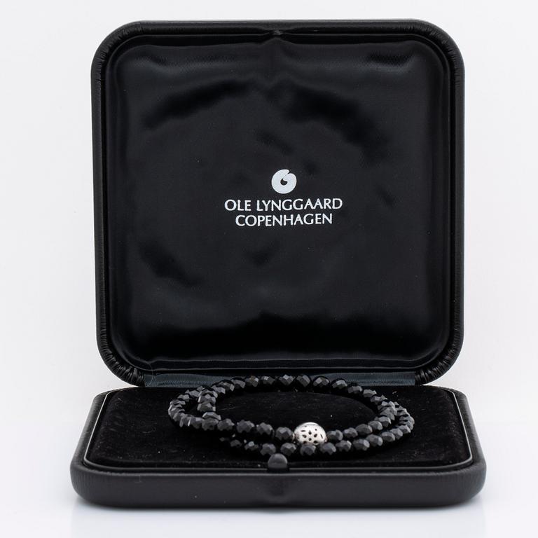 OLE LYNGGAARD necklace, onyx beads approx 6 mm, clasp 18K whitegold approx 10 mm, CL 750 inscribed, original case.