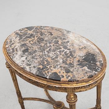 A Louis XVI-style table, circa 1900.