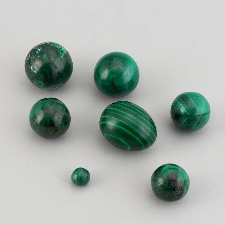 Six 20th century malachite balls and an egg.