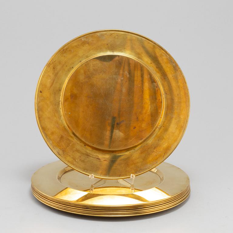 Eight brass plates by Stelton, Denmark, second half of the 20th century.
