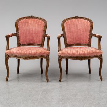 A pair of 19th-century rococo revival arm-chairs.