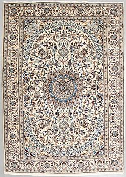 A Nain rug, part silk, 290 x 195 cm.