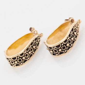 14K gold hoop earrings.