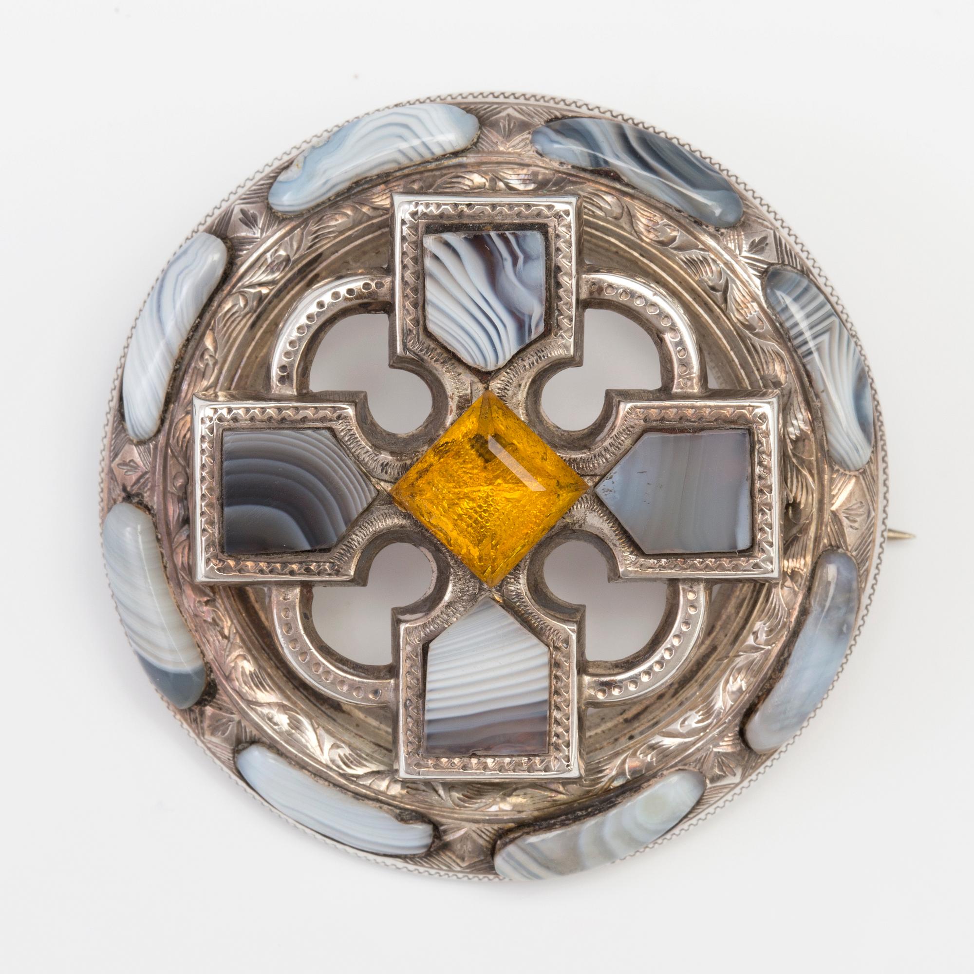 A BROOCH set with agate and paste.