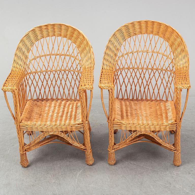 A pair of 1970s/1980s rattan armchairs.