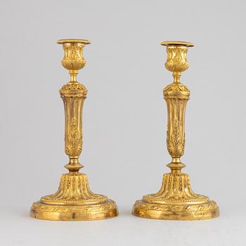 A pair of Louis XVI candlesticks.