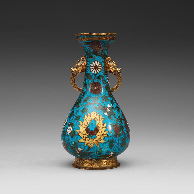 A cloisonné vase decorated with lotus-scrolls, and dragon- shaped gilded handles, Ming Dynasty (1368-1644).