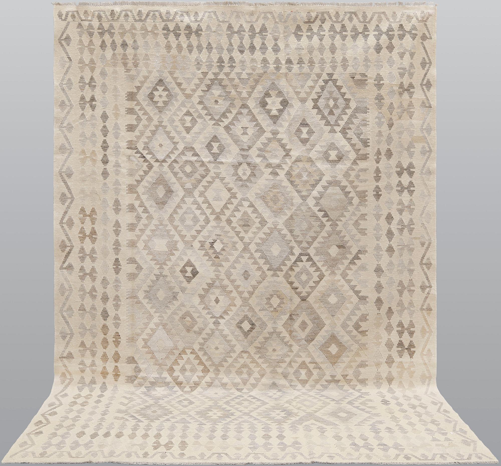 A kilim carpet, c 293 x 203.