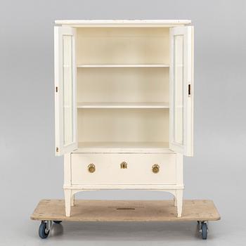 A display cabinet, early 20th century.