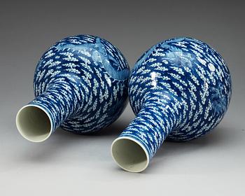 A pair of blue and white vases, late Qing dynasty, with Kangxi four character mark.