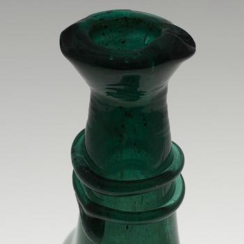 A 18th century glass bottle.