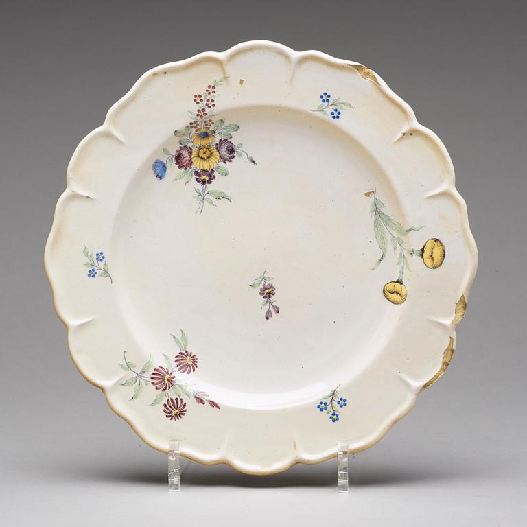 A set of six odd Swedish faience plates, Marieberg and Rörstrand, 18th Century.