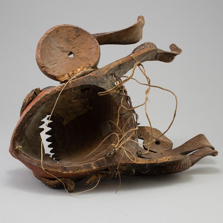 A large wooden dance mask, South-East Asia, early 20th Century.