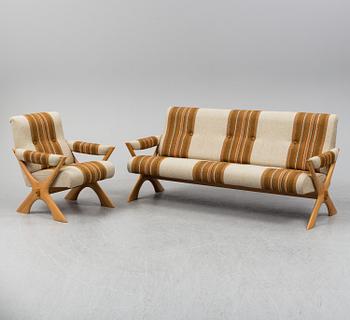 A 1960/70's pine sofa, armchair and coffee table.
