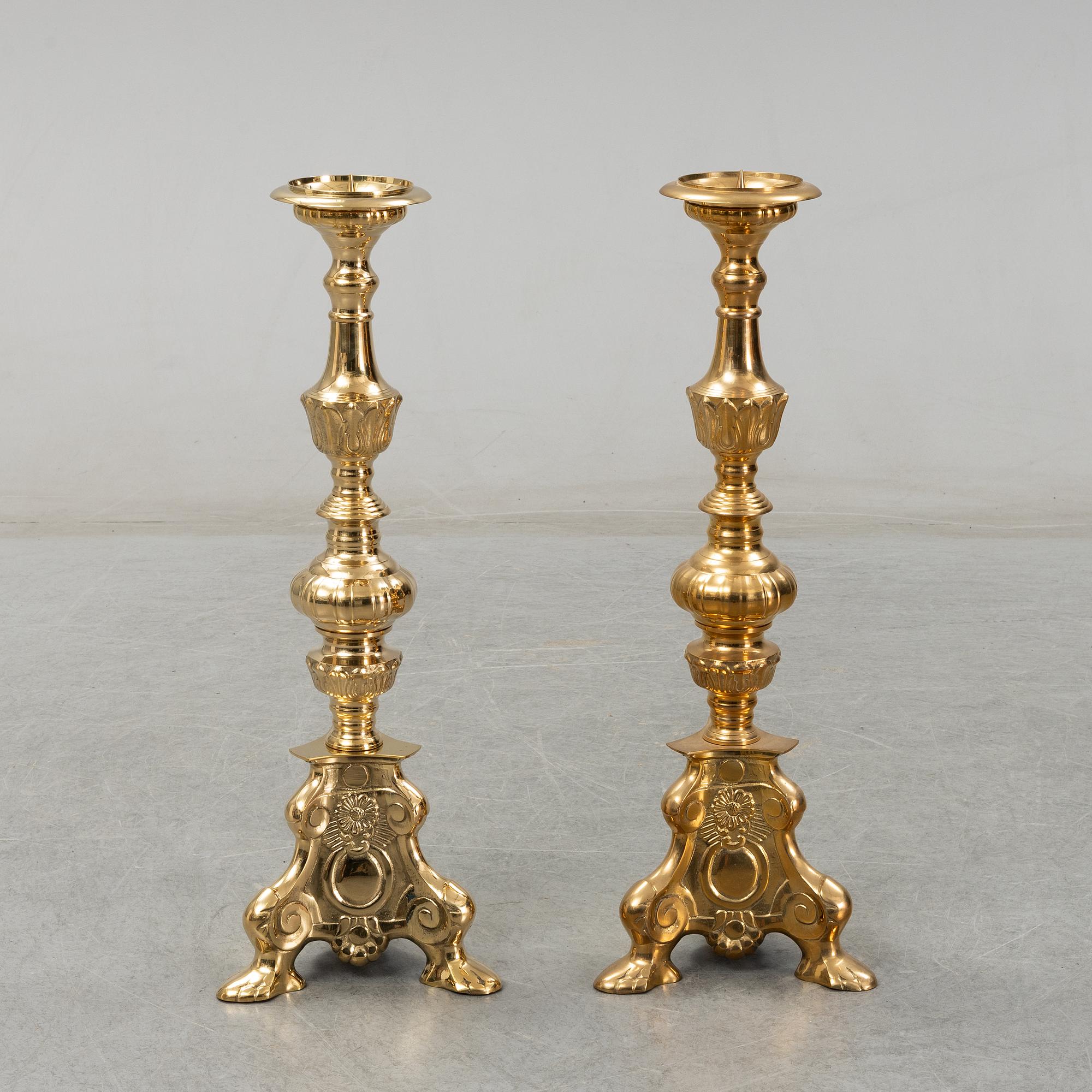 A pair of late 20th century or early 21th century brass altar candlesticks.