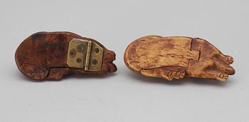 Two 19th - 20th century birch snuffboxes in the shape of lying dogs.