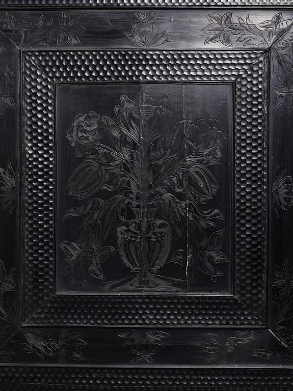 A Louis XIV and Louis XIV-style carved ebony, ivory and tortoiseshell-inlaid cabinet on stand, 17th and 19th century.