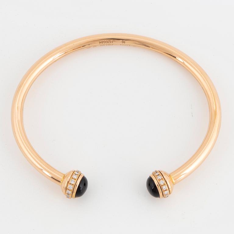 Piaget 18K rose gold, brilliant-cut diamonds and onyx cabochons.
